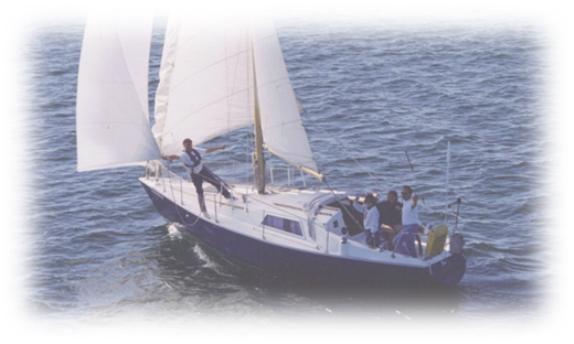 A group of people on a sailboat in the water
Description automatically generated with medium confidence